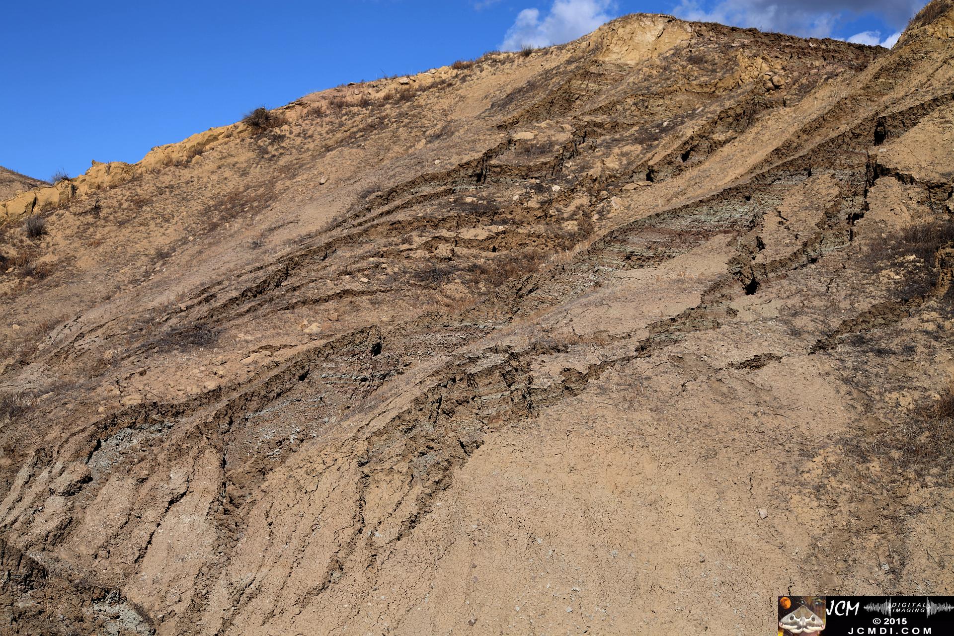Landslide, buckled pavement, and terrain at Vasquez Canyon Road in Santa Clarita, CA filmed 11-25-2015